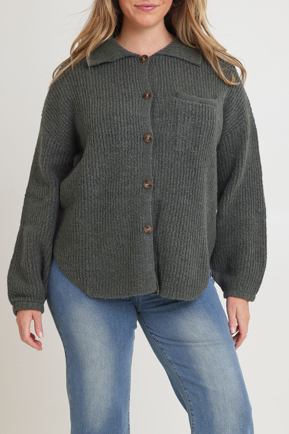 Model Chanel wearing size XL of the Cuddle Up To Me Knit Cardi in colour Gumnut (Green), from the front, cropped image