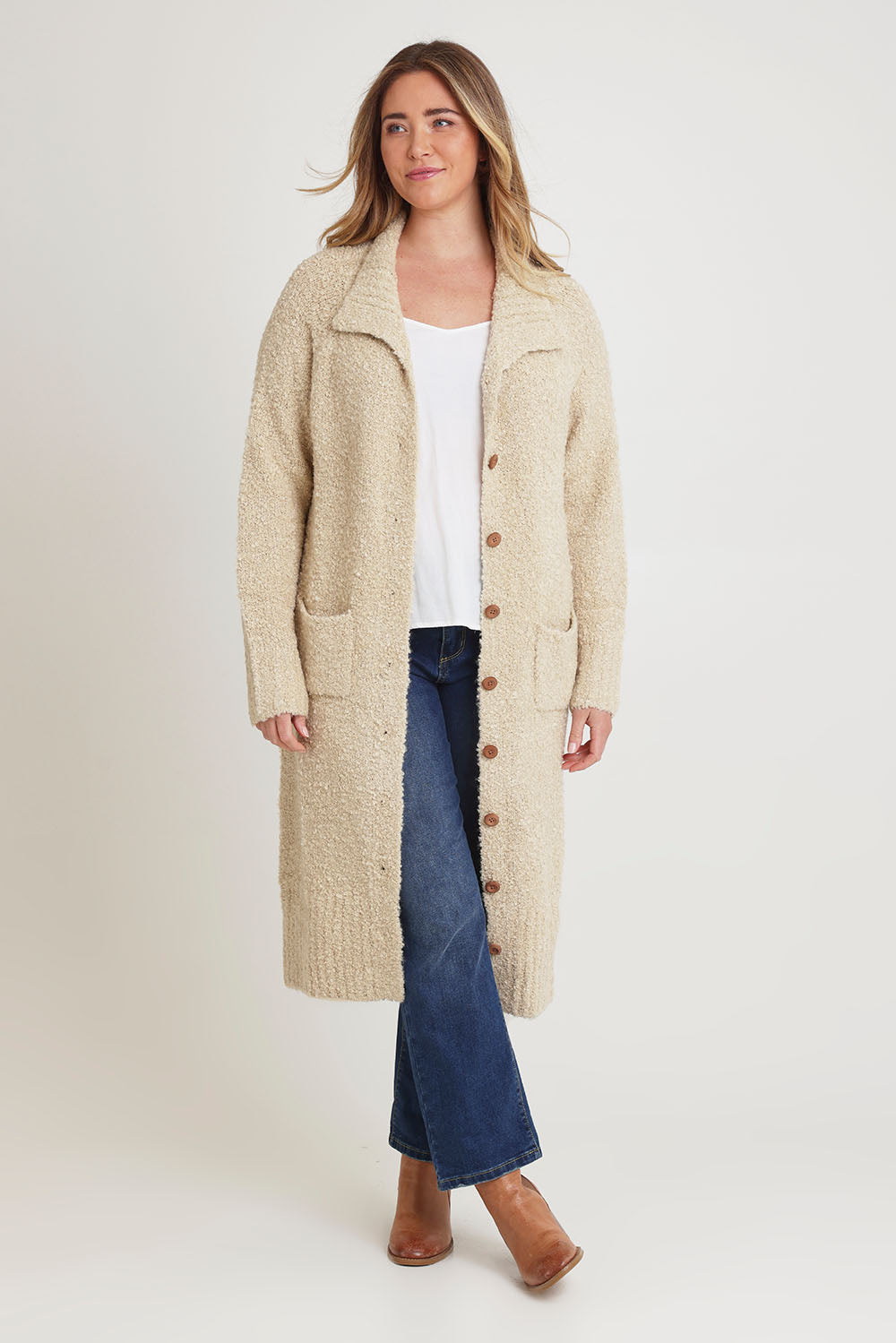 Model Chanel wearing size XL of the Sunday Walks Longline Cardi in colour Sand, from the front, showing the whole outfit