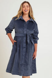 Model Chanel wearing size 16 of the High Impact Cord Dress in colour Blue (Blue), from the front, cropped image