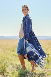 Model Tegan wearing size 10 of the High Impact Cord Dress in colour Blue (Blue), from the front, showing the whole outfit