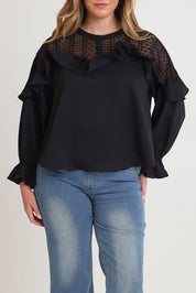 Model Chanel wearing size 16 of the Good Feels Lace Detail Blouse in colour Black (Black), from the front, cropped image