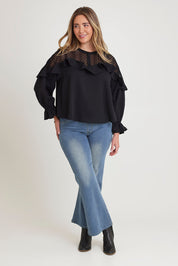 Model Chanel wearing size 16 of the Good Feels Lace Detail Blouse in colour Black (Black), from the front, showing the whole outfit
