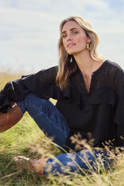 Model Tegan wearing size 10 of the Good Feels Lace Detail Blouse in colour Black (Black), from the front, showing the whole outfit