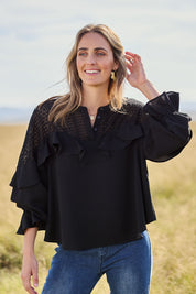 Model Tegan wearing size 10 of the Good Feels Lace Detail Blouse in colour Black (Black), from the front, showing the whole outfit