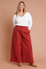 Model Chanel wearing size 16 of the Take The High Road Cotton Wide Leg Pants in colour Bordeaux (Red), from the front, showing the whole outfit