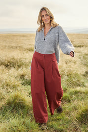 Model Tegan wearing size 10 of the Take The High Road Cotton Wide Leg Pants in colour Bordeaux (Red), from the front, showing the whole outfit