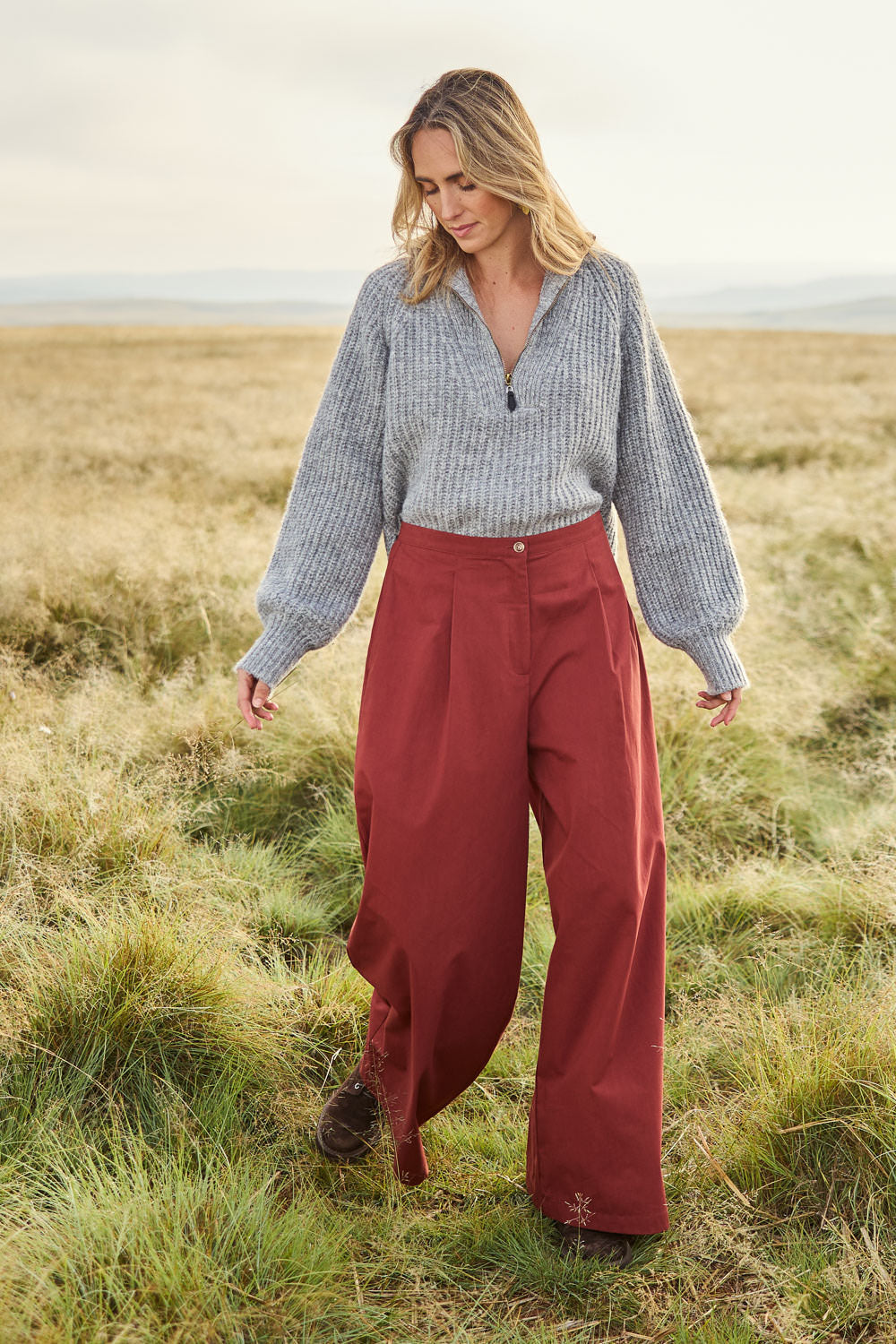 Model Tegan wearing size 10 of the Take The High Road Cotton Wide Leg Pants in colour Bordeaux (Red), from the front, showing the whole outfit