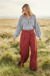 Model Tegan wearing size 10 of the Take The High Road Cotton Wide Leg Pants in colour Bordeaux (Red), from the front, showing the whole outfit