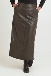 Model Chanel wearing size 16 of the Easy Elegance Vegan Leather Maxi Skirt in colour Olive (Green), from the front, cropped image