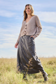 Model Tegan wearing size 10 of the Easy Elegance Vegan Leather Maxi Skirt in colour Olive (Green), from the front, showing the whole outfit