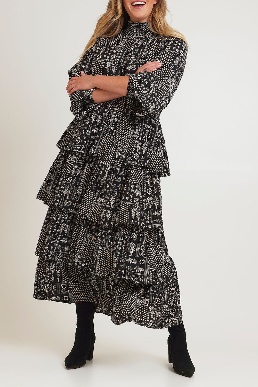 Model Chanel wearing size 16 of the Wonderland Tiered Dress in colour Blackwhite (Black), from the front, cropped image