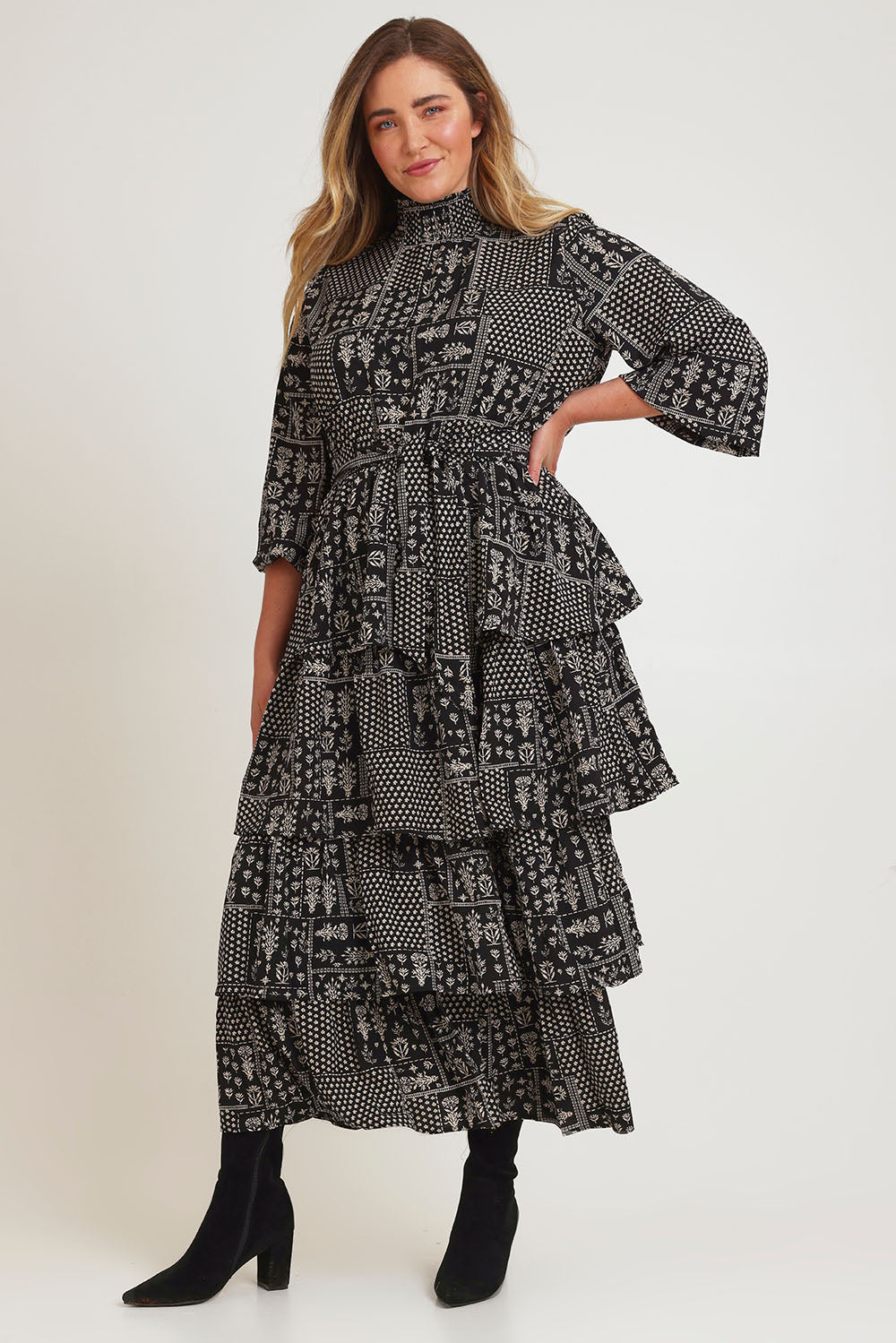 Model Chanel wearing size 16 of the Wonderland Tiered Dress in colour Blackwhite (Black), from the front, showing the whole outfit