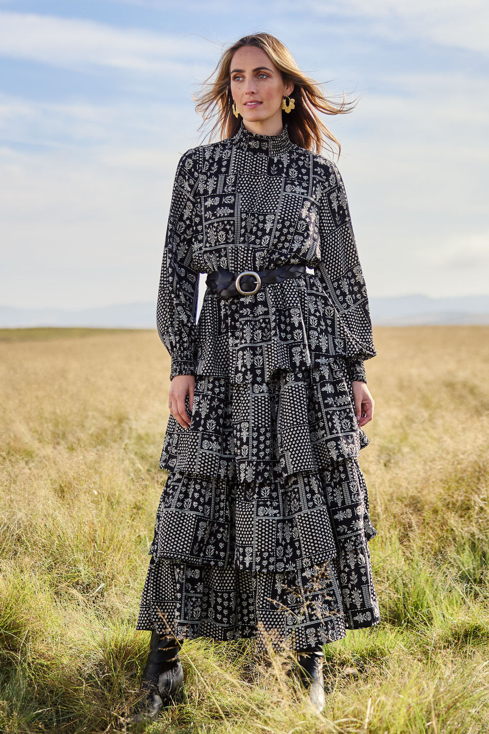 Model Tegan wearing size 10 of the Wonderland Tiered Dress in colour Blackwhite (Black), from the front, showing the whole outfit