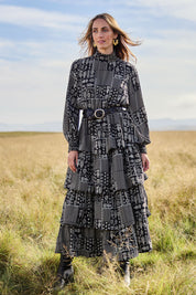 Model Tegan wearing size 10 of the Wonderland Tiered Dress in colour Blackwhite (Black), from the front, showing the whole outfit