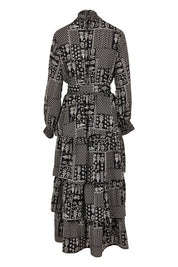 Product shot of the Wonderland Tiered Dress in colour Blackwhite (Black), from the back