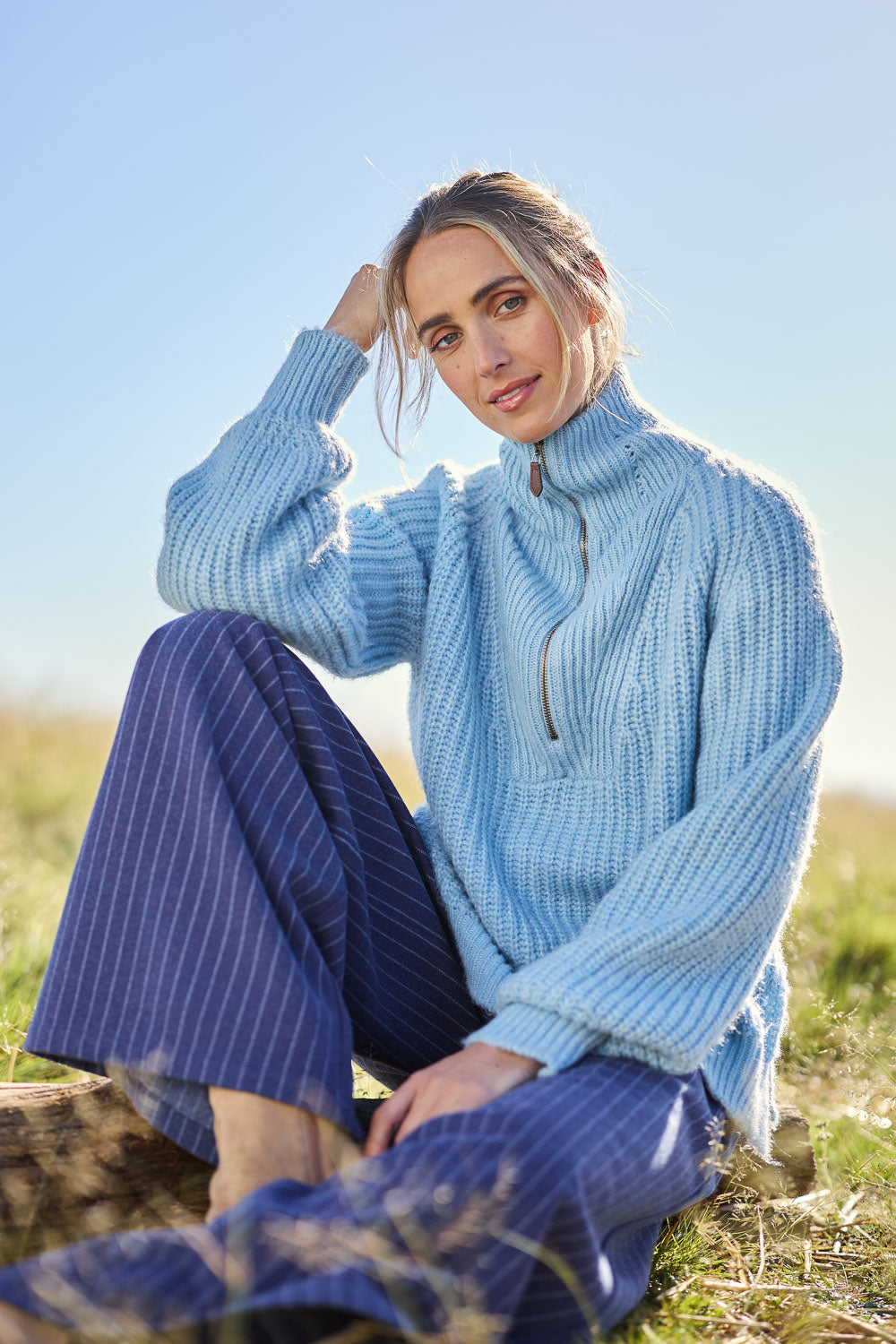 Model Tegan wearing size S of the Always Yours Half Zip Sweater in colour Babyblue (Blue), from the front, showing the whole outfit