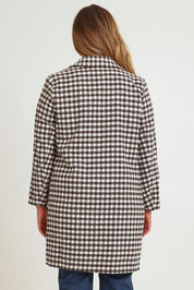Model Chanel wearing size 16 of the Checked In Overcoat in colour Chocheck, from the back