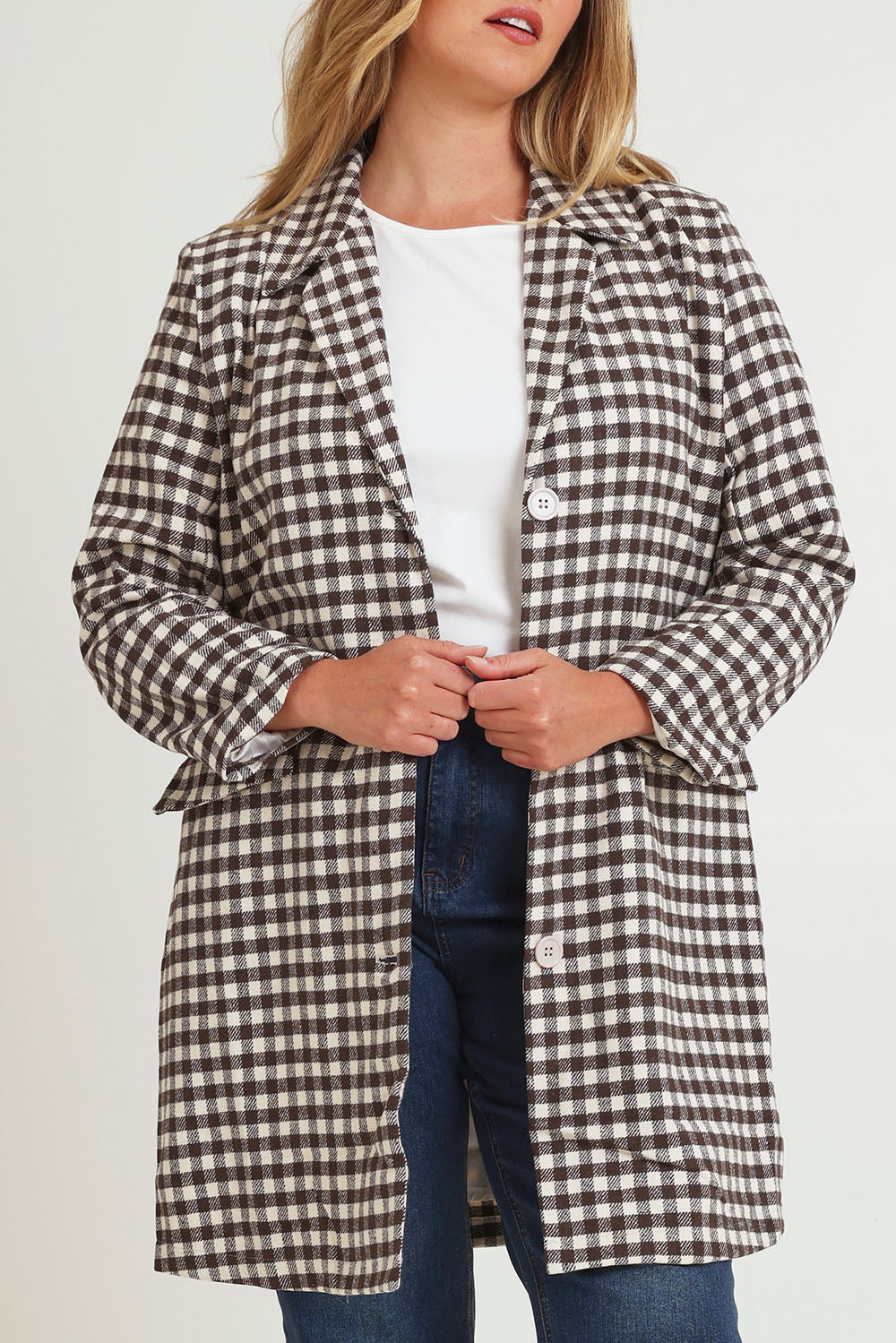 Model Chanel wearing size 16 of the Checked In Overcoat in colour Chocheck, from the front, cropped image