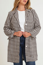 Model Chanel wearing size 16 of the Checked In Overcoat in colour Chocheck, from the front, cropped image