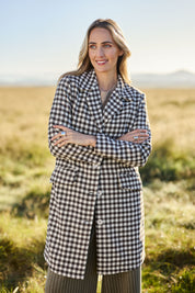 Model Tegan wearing size 10 of the Checked In Overcoat in colour Chocheck, from the front, showing the whole outfit