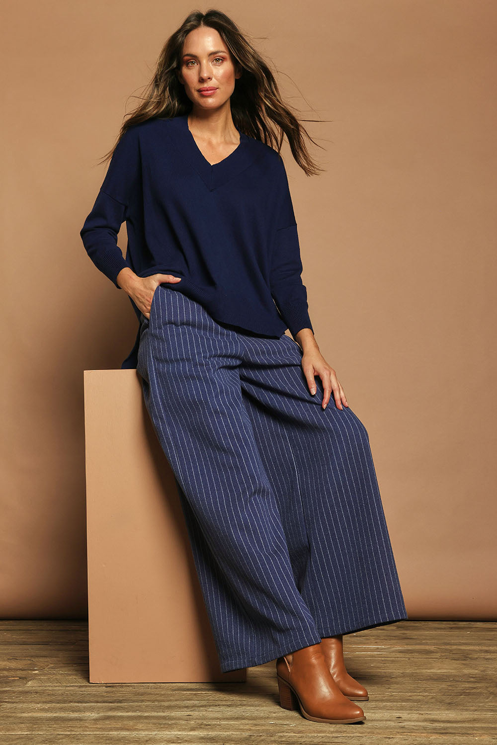Model Madeline wearing size 10 of the Walk This Way Wide Leg Pants in colour Bluestripe (Blue), from the front, showing the whole outfit