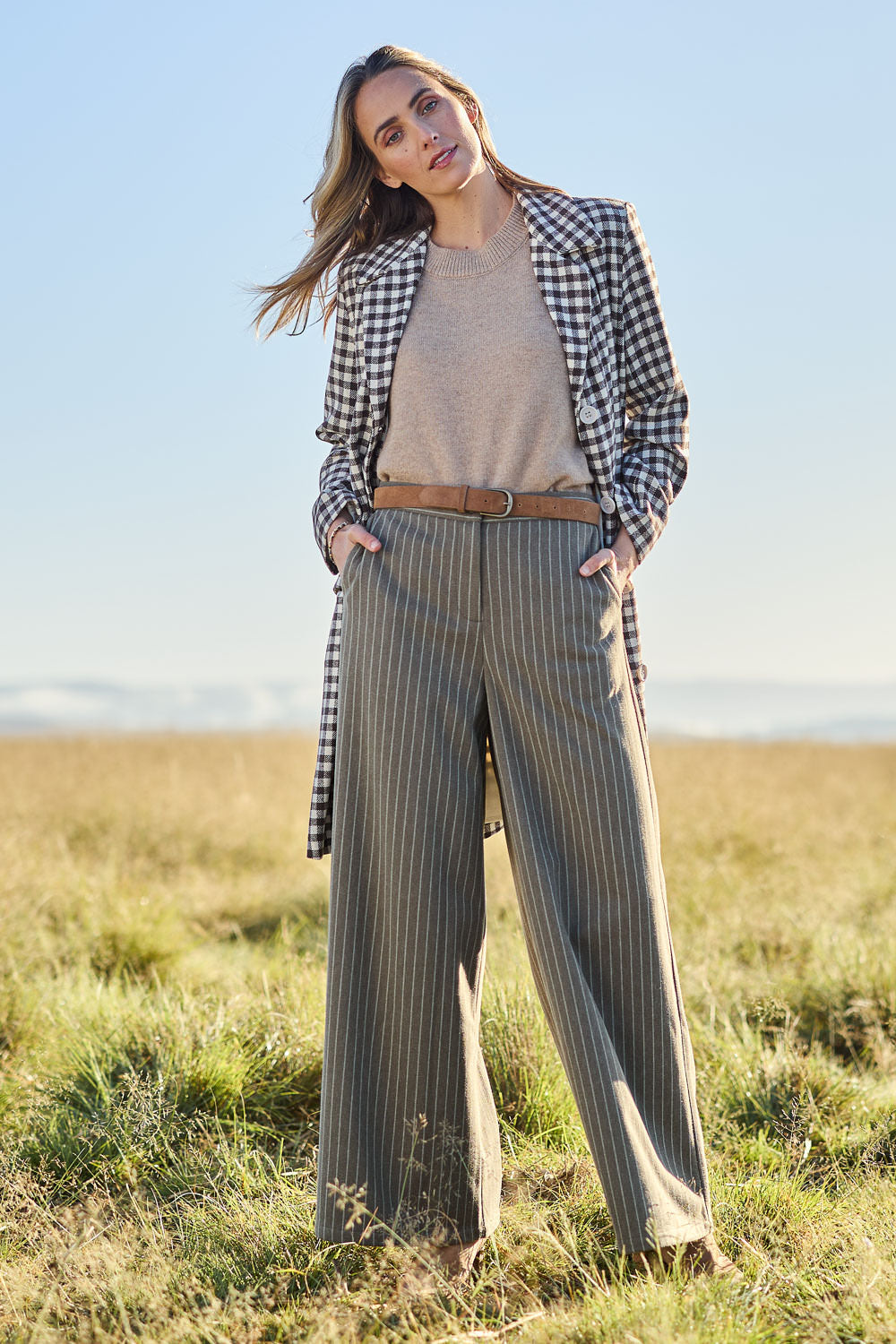 Model Tegan wearing size 10 of the Walk This Way Wide Leg Pants in colour Chocstripe, from the front, showing the whole outfit