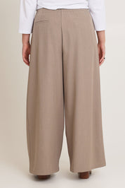 Model Chanel wearing size 16 of the Always Ready Cross Front Wide Leg Pants in colour Rock, from the back