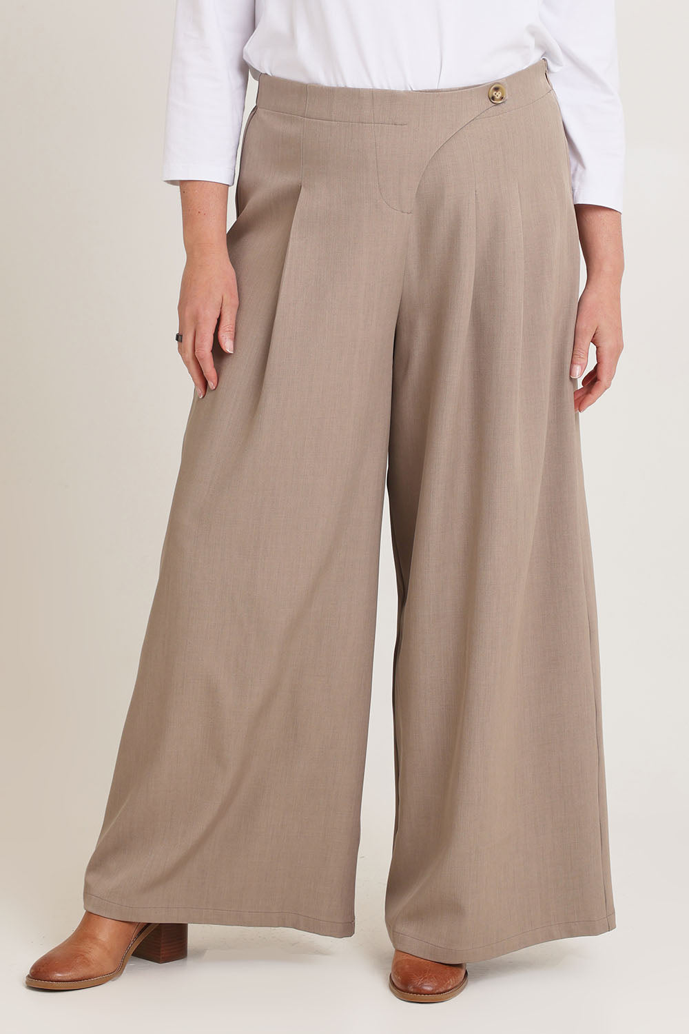Model Chanel wearing size 16 of the Always Ready Cross Front Wide Leg Pants in colour Rock, from the front, cropped image