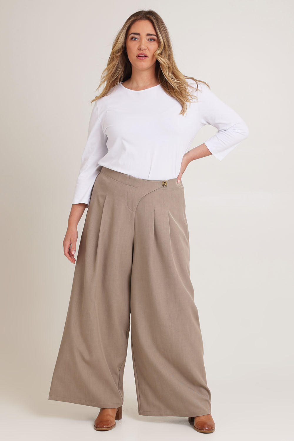 Model Chanel wearing size 16 of the Always Ready Cross Front Wide Leg Pants in colour Rock, from the front, showing the whole outfit