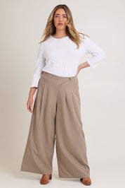Model Chanel wearing size 16 of the Always Ready Cross Front Wide Leg Pants in colour Rock, from the front, showing the whole outfit