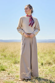 Model Courtney wearing size 10 of the Always Ready Cross Front Wide Leg Pants in colour Rock, from the front, showing the whole outfit