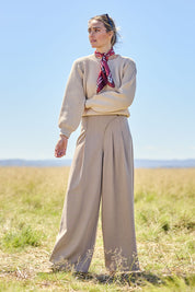 Model Tegan wearing size 10 of the Always Ready Cross Front Wide Leg Pants in colour Rock, from the front, showing the whole outfit