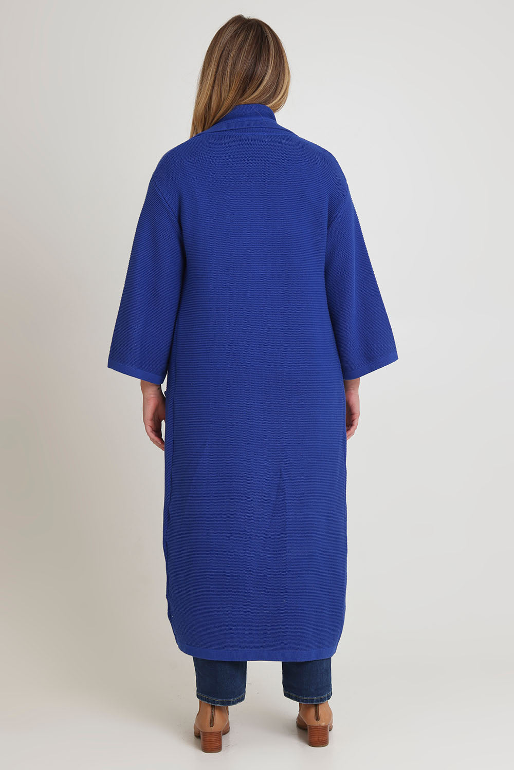 Model Chanel wearing size XL of the Delight Me Long Cotton Cardi in colour Electric (Blue), from the back