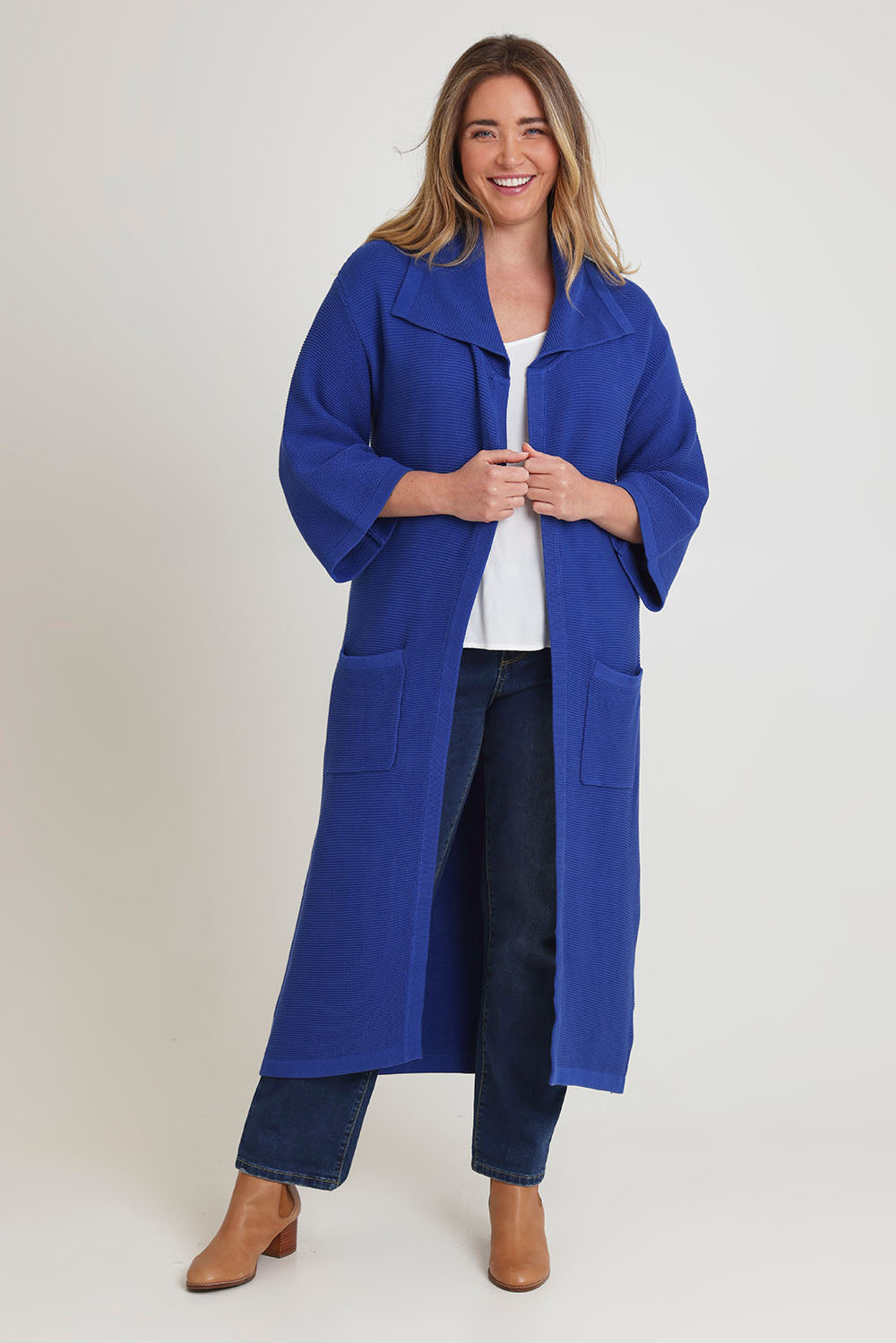 Model Chanel wearing size XL of the Delight Me Long Cotton Cardi in colour Electric (Blue), from the front, showing the whole outfit