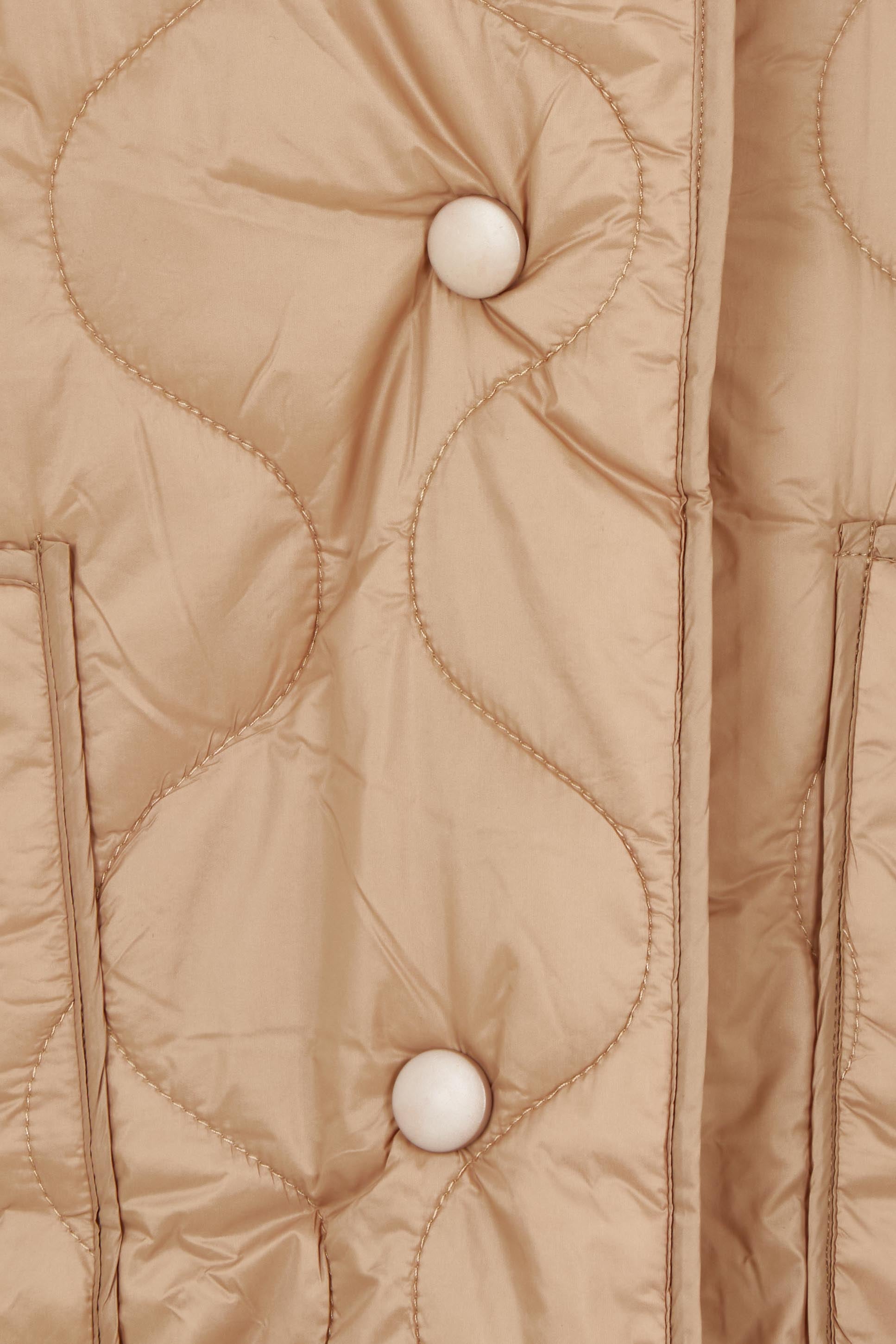 Product shot of the Heart Warming Oversized Quilted Jacket in colour Earth, detail