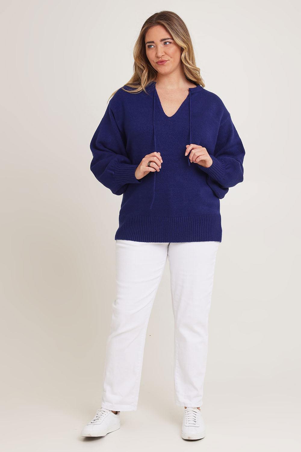 Model Chanel wearing size XL of the Cozy As A Cloud Balloon Sleeve Jumper in colour Royal (Blue), from the front, showing the whole outfit