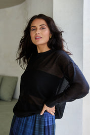 Model Tahnee wearing size S of the Evening Star Linen Blend Knit Jumper in colour Black (Black), from the front, showing the whole outfit
