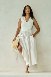 Model Tahnee wearing size 10 of the Sweet Intentions V Neck Maxi Dress in colour Cream, from the front, showing the whole outfit