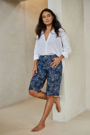 Model Tahnee wearing size 10 of the Say It With Flowers Longline Denim Shorts in colour Denim (Blue), from the front, showing the whole outfit