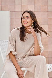 Model Tegand wearing size 10 of the Summer Ready Cotton Throw Sweater – Natural in colour Natural, from an angle