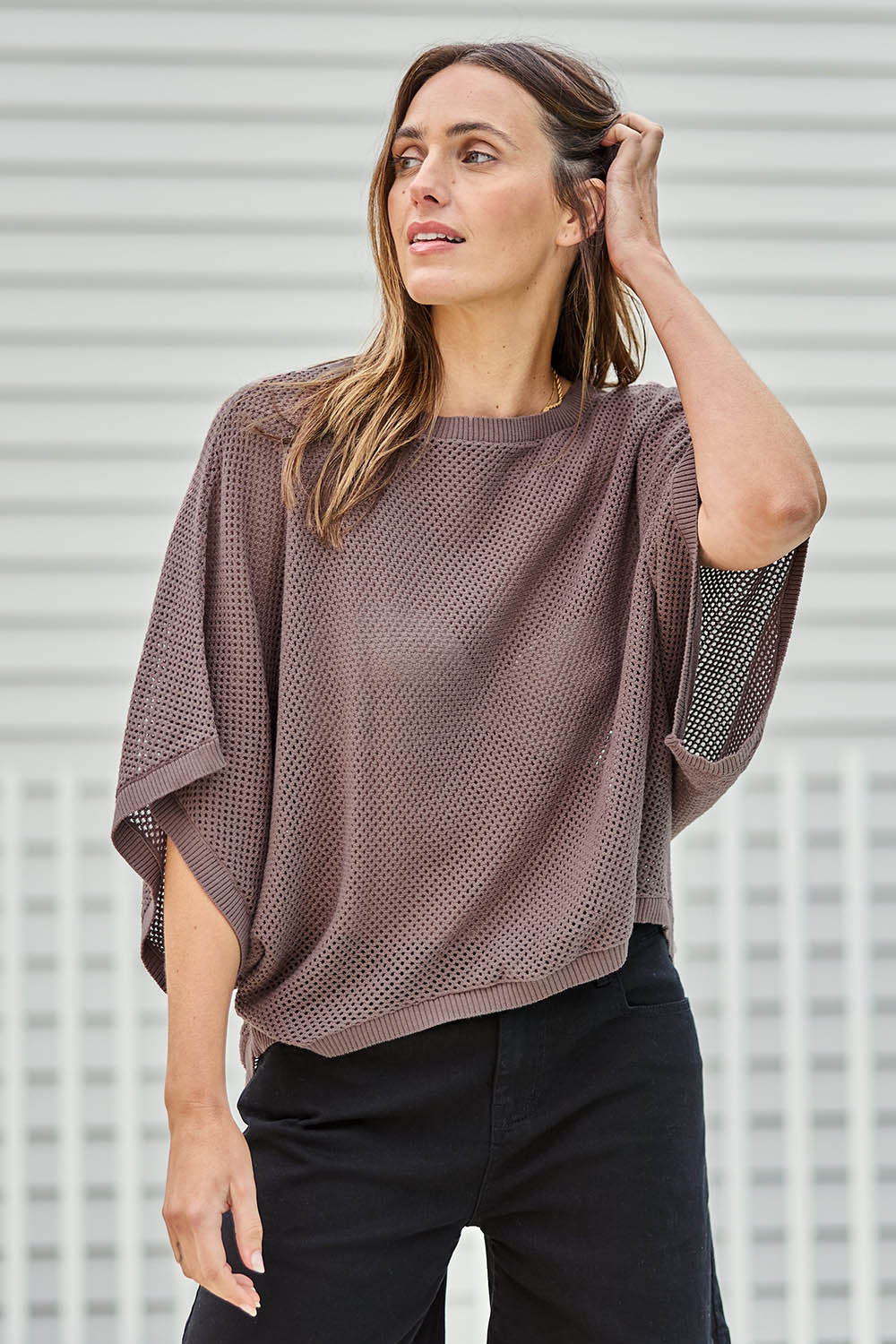 Model Tegand wearing size 10 of the Summer Ready Cotton Throw Sweater – Pecan in colour Pecan, from an angle