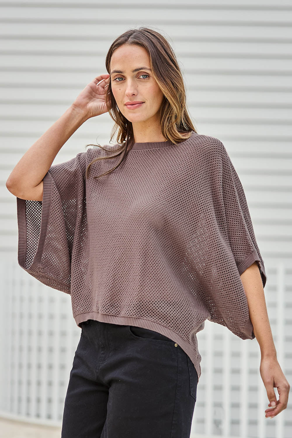 Model Tegand wearing size 10 of the Summer Ready Cotton Throw Sweater – Pecan in colour Pecan, in a cropped view