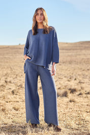 Model Tegan wearing size S of the Easy Does It Knit Top in colour Denim (Blue), from the front, showing the whole outfit