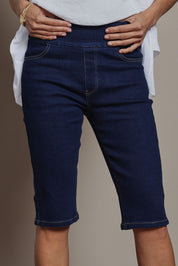 Model Amanda wearing size 10 of the Easy As Pull On Long Shorts in colour Denim (Blue), from the front, cropped image