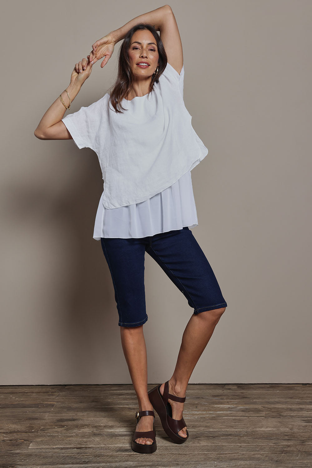 Model Amanda wearing size 10 of the Easy As Pull On Long Shorts in colour Denim (Blue), from the front, showing the whole outfit