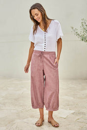 Model Tegand wearing size 10 of the Summer Daze Striped Pull On 3/4 Pant – Plum in colour Plum, from the front