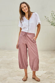 Model Tegand wearing size 10 of the Summer Daze Striped Pull On 3/4 Pant – Plum in colour Plum, from the front
