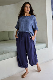 Model Tahnee wearing size 10 of the Summer Daze Linen Blend Pull On 3/4 Pant in colour Navy (Blue), from the front, showing the whole outfit