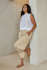 Model Tahnee wearing size 10 of the Summer Daze Linen Blend Pull On 3/4 Pant in colour Sand, from the front, showing the whole outfit