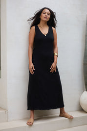 Model Tahnee wearing size S of the Feeling Mighty Fine Fringe Hem Knit Maxi Dress in colour Black (Black), from the front, showing the whole outfit